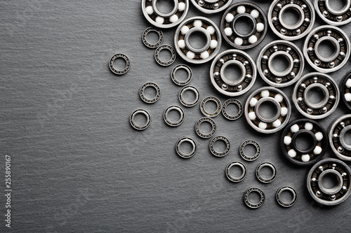 Frame of various ball bearings with free space. Technology and machinery industrial background. photo