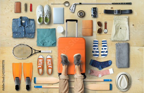 Travel concept with a large suitcase and other accessories photo