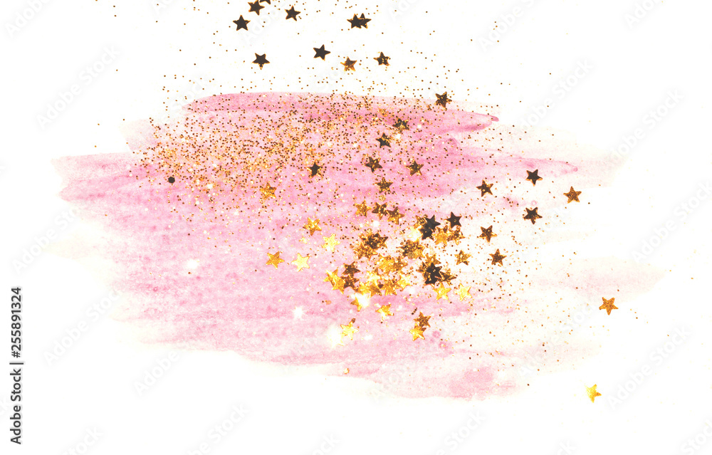 Golden glitter and glittering stars on abstract pink watercolor splash on white background