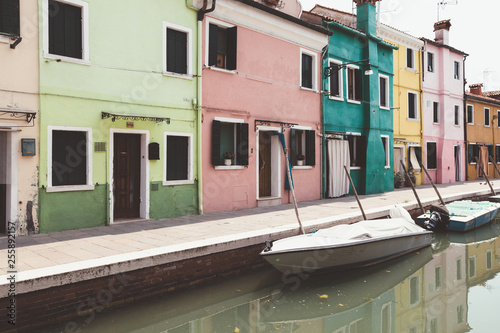 Panoramic view of coloured homes and water canal with boats in Burano © TravelFlow