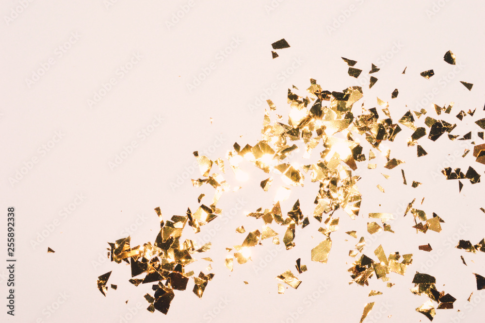 Background with gold glitter, pieces of foil, background in vintage colors for your design Background with gold glitter, pieces of foil, background in vintage colors for your design