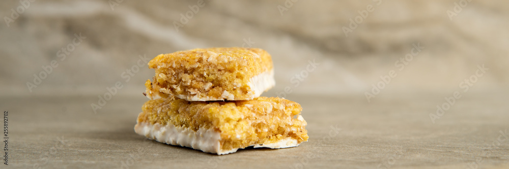 Muesli and cereal bar on marble stone background Muesli and cereal bar on marble stone background