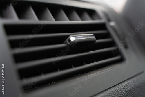 the deflector on the grey panel of the car. car heating and air conditioning system