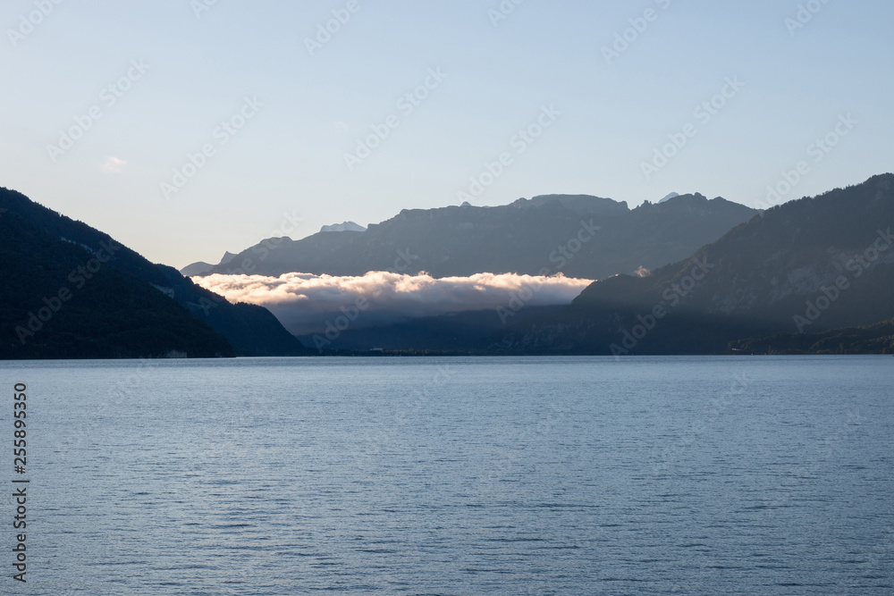 Panorama of Thun lake and away mountains in city Spiez, Switzerland