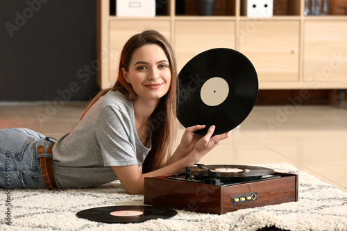 Young woman with old record...