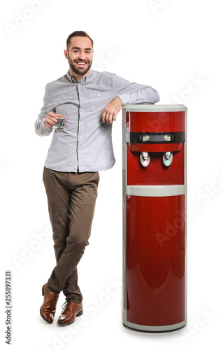 Man near water cooler on wh...