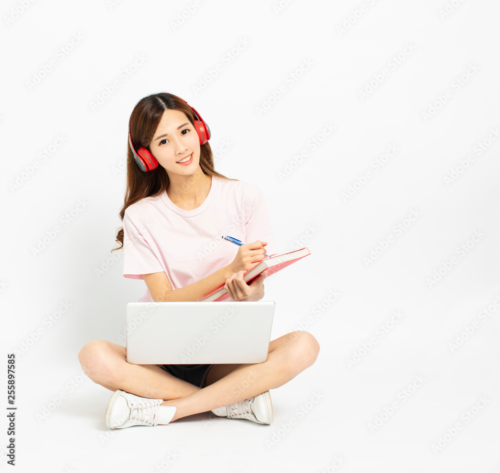 Happy student girl sitting on the floor using laptop Happy student girl sitting on the floor using laptop