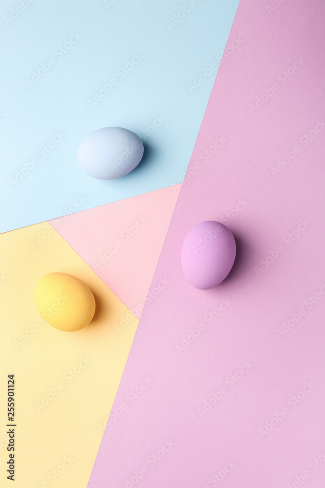 Easter eggs on color background