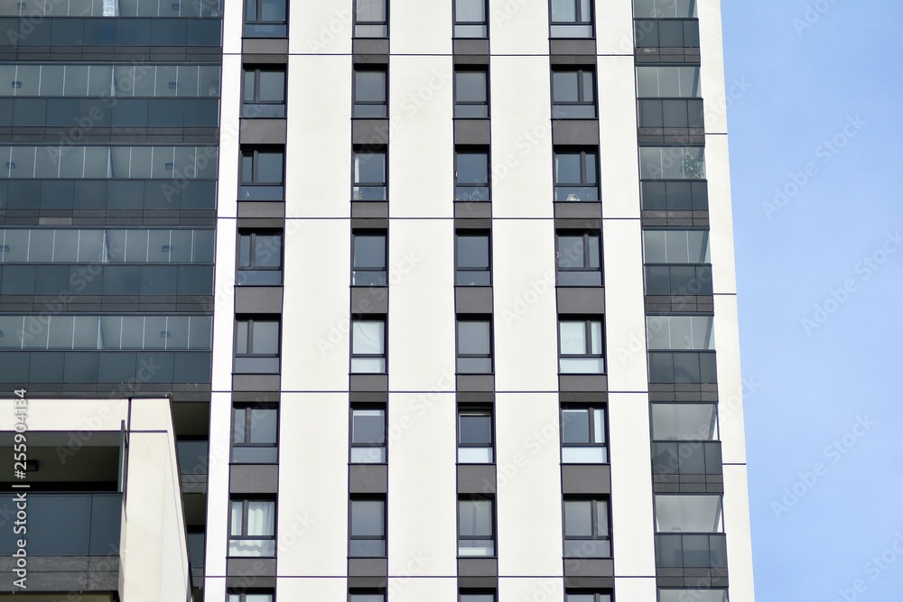 Multistory new modern apartment building. Stylish living block of flats. Multistory new modern apartment building. Stylish living block of flats.