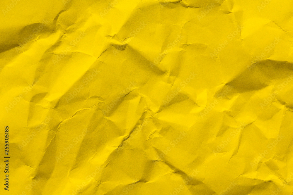 Yellow crumpled paper background Yellow crumpled paper background