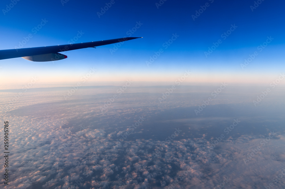 Fototapeta premium Beautiful sky in evening from window airplane