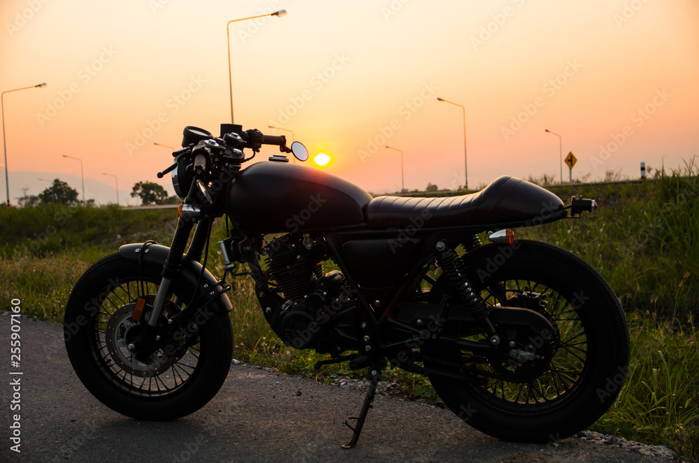 Fototapeta premium vintage motorcycle cafe racer style with sunset scene