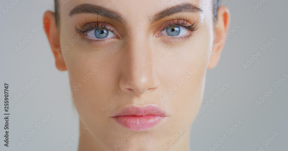 Portrait of close up smiling woman with beautiful face and perfect skin just cleaned from impurities pampering it gently with fingers to prepare for day or night cream. Portrait of close up smiling woman with beautiful face and perfect skin just cleaned from impurities pampering it gently with fingers to prepare for day or night cream.