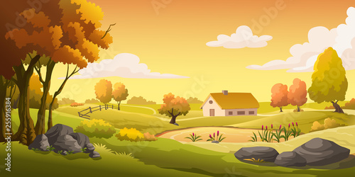 Houses and grasslands at the hill at sunset.