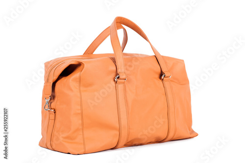 Konstfotografi Orange-brown  leather bag for storing things and traveling on a white isolated background