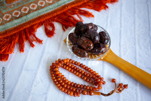 fthar Food evening meal for Ramadan kareem,Concept: Date of Islamic fasting,fruit date placed on a white background rosary photo