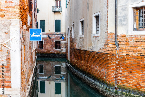 Gondola sign on a empty canal in Venice, Italy © Victor