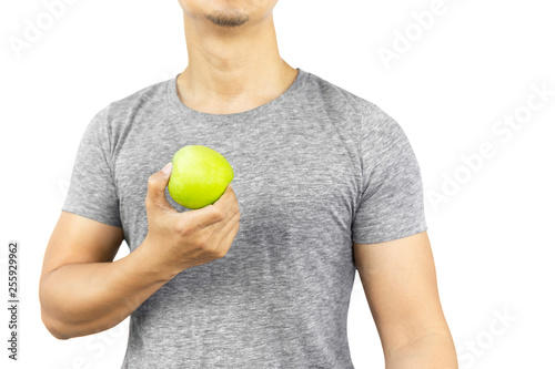 Healthy man holding fresh green apple isolated in clipping path.
