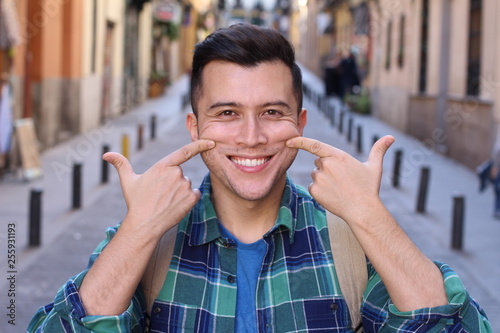 Man forced to smile outdoors 