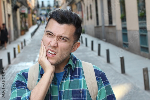 Photography Unhappy man suffering from bruxism