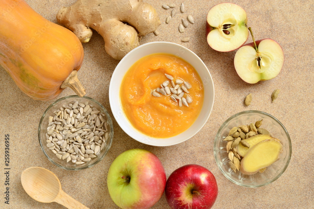 Roasted apple, pumpkin, ginger soup with cardamom, sprinkled with sunflower seeds, view from above Roasted apple, pumpkin, ginger soup with cardamom, sprinkled with sunflower seeds, view from above