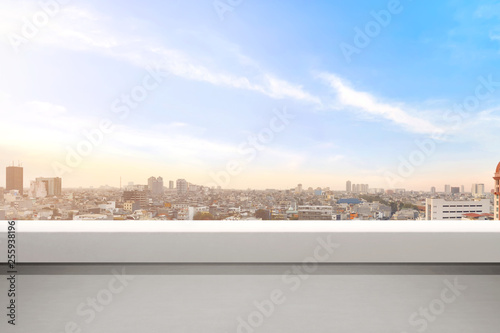 Empty balcony with modern cityscapes and blue sky background
