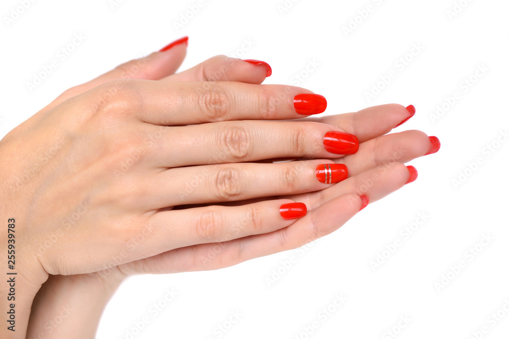 Closeup of hands of a young woman with red manicure on nails Closeup of hands of a young woman with red manicure on nails