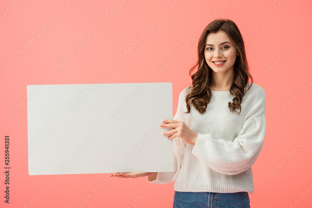 smiling and beautiful woman holding blank placard with copy space isolated on pink smiling and beautiful woman holding blank placard with copy space isolated on pink