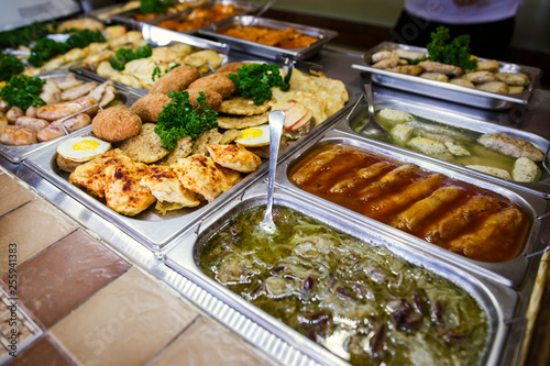A set of meat dishes in the trays