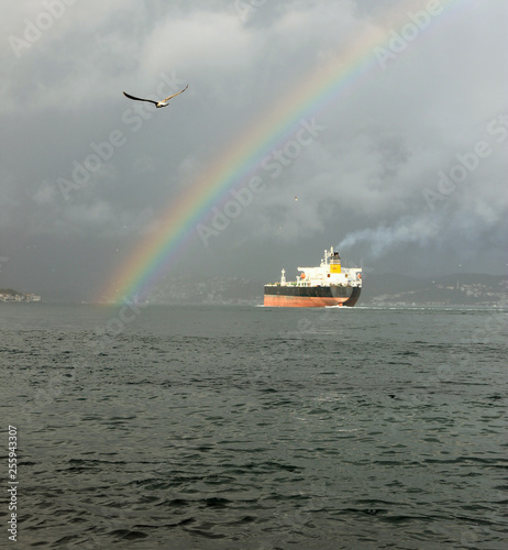 rainbow sea and ship