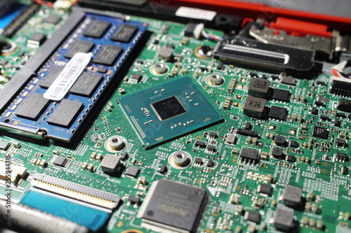 Closeup view at laptop motherboard and components.