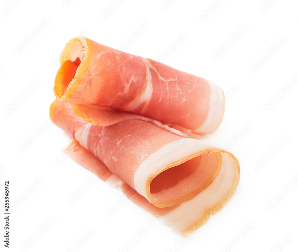 Rolled slices of ham on a white background