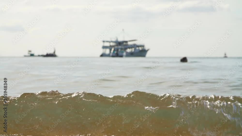 Tropical sand beach with a boat on horizon Tropical sand beach with a boat on horizon