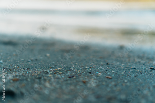 Copy space of grey sand and blue color summer beach background.