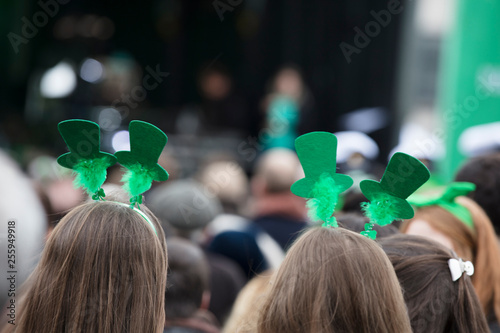 People wearing St Patricks day headbands at an st patrick's day event photo