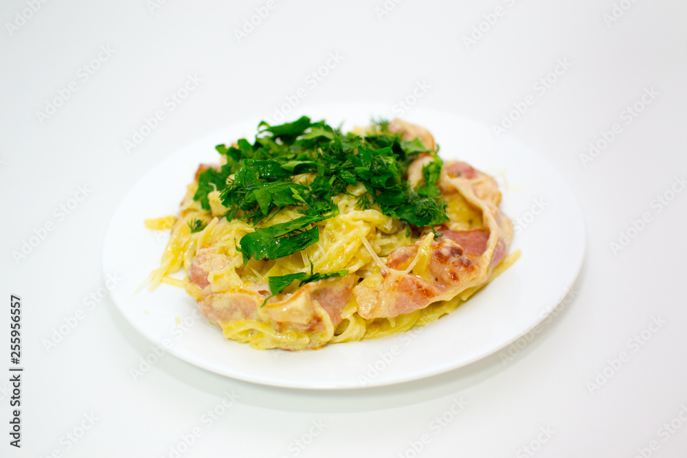 Pasta Carbonara. Cooking at home. Spaghetti with bacon, herbs and Parmesan cheese. Pasta Carbonara on a white background. Italian food concept. Pasta Carbonara. Cooking at home. Spaghetti with bacon, herbs and Parmesan cheese. Pasta Carbonara on a white background. Italian food concept.