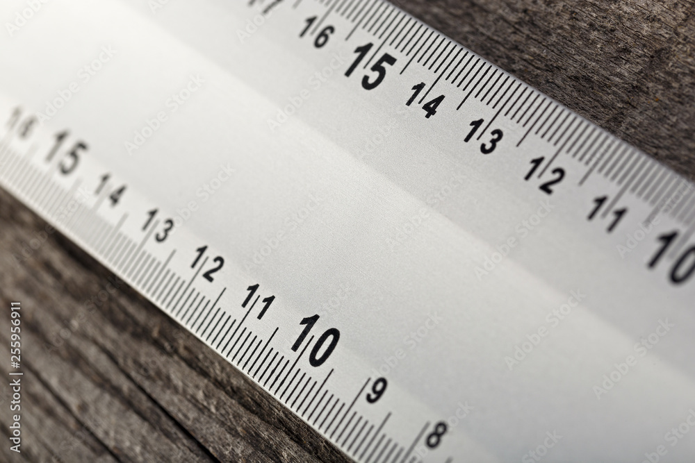 Measuring instrument on a wooden background. Tool for repair and construction. Measuring instrument on a wooden background. Tool for repair and construction.