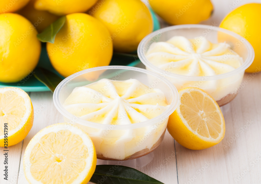 Plastic jar with lemon cheesecake mousse dessert Plastic jar with lemon cheesecake mousse dessert