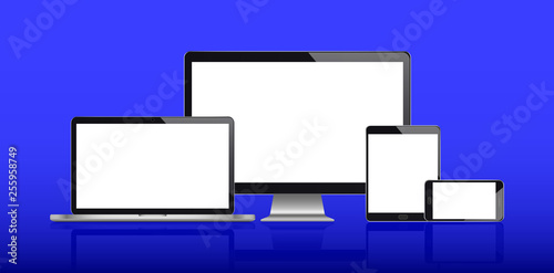 Realistic set of monitor, laptop, tablet, smartphone on a blue background.