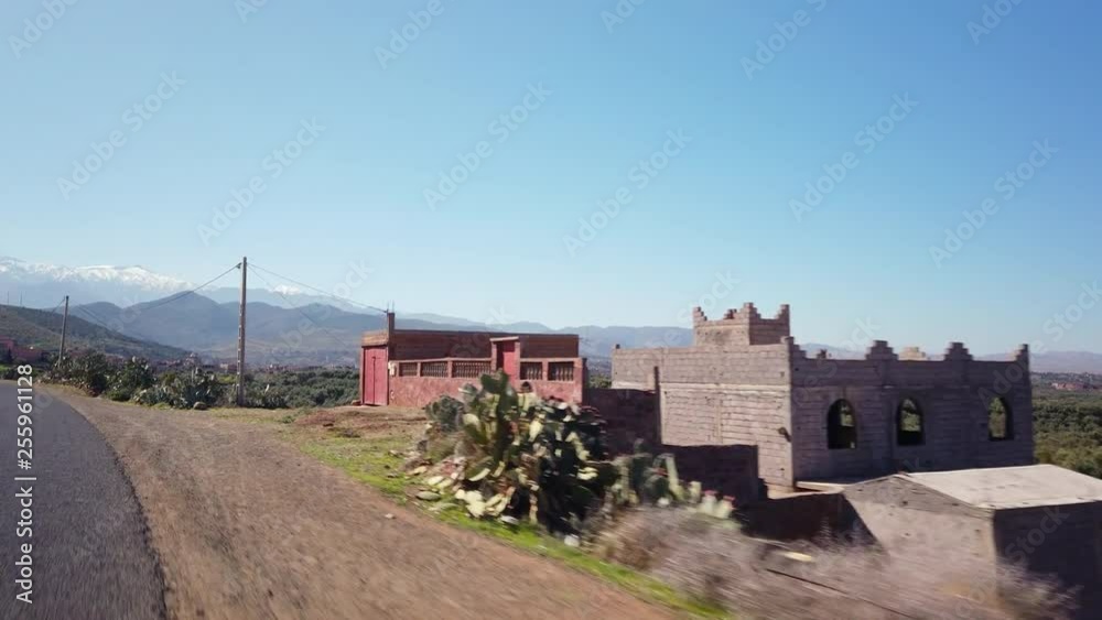 Driving in rural Morocco., Africa. Atlas mountains at the horizon. Driving in rural Morocco., Africa. Atlas mountains at the horizon.