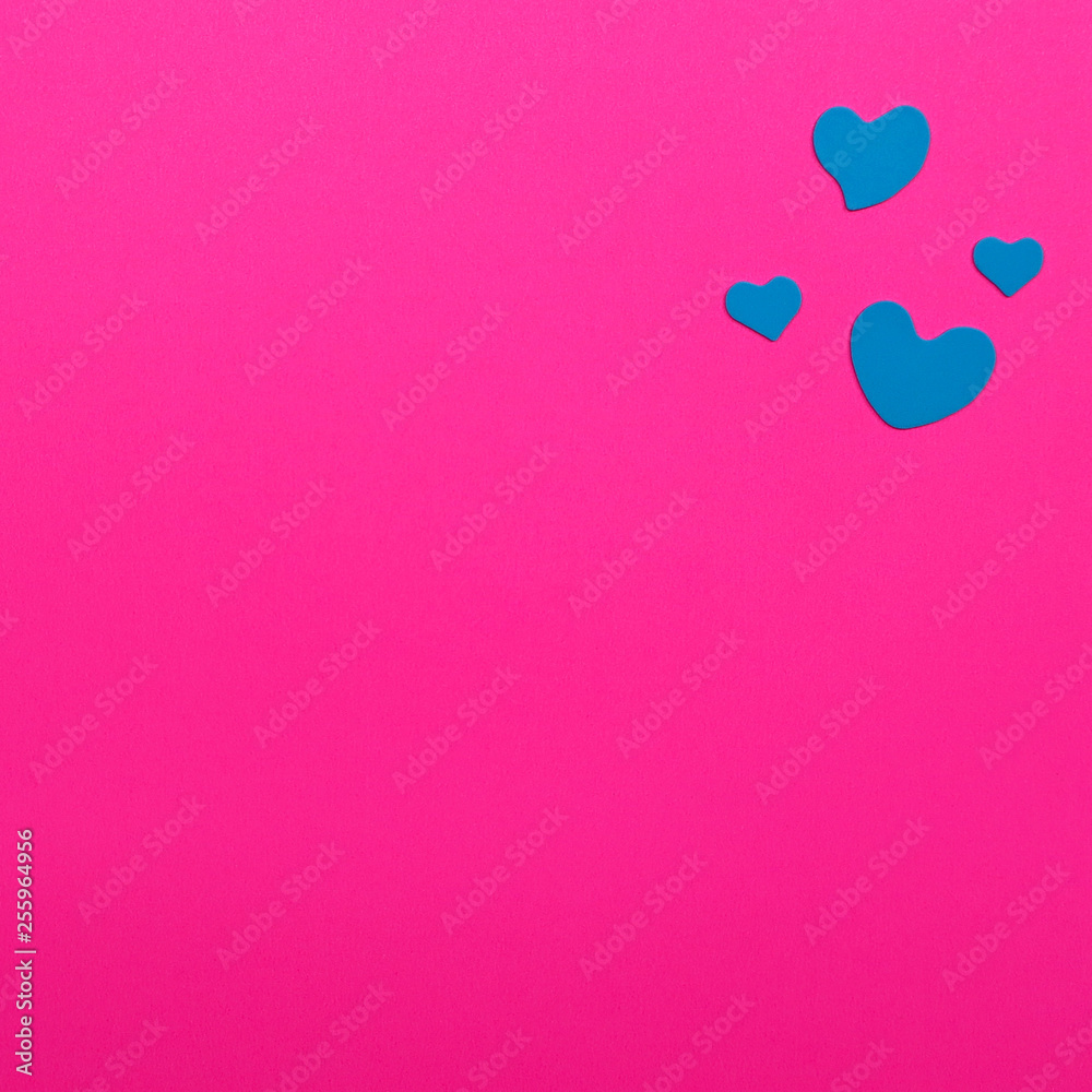 Blue heart on pink paper