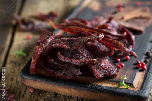 Fotografía Beef Jerky on a Rustic Wooden Table