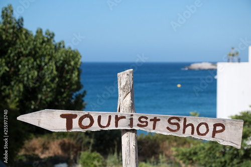 Wooden Board with the inscription shop for tourists. "Tourist shop"