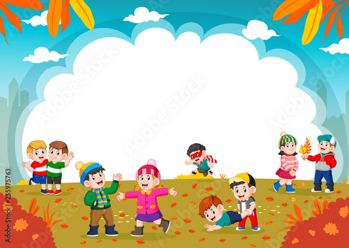 Happy children playing with autumn leaves