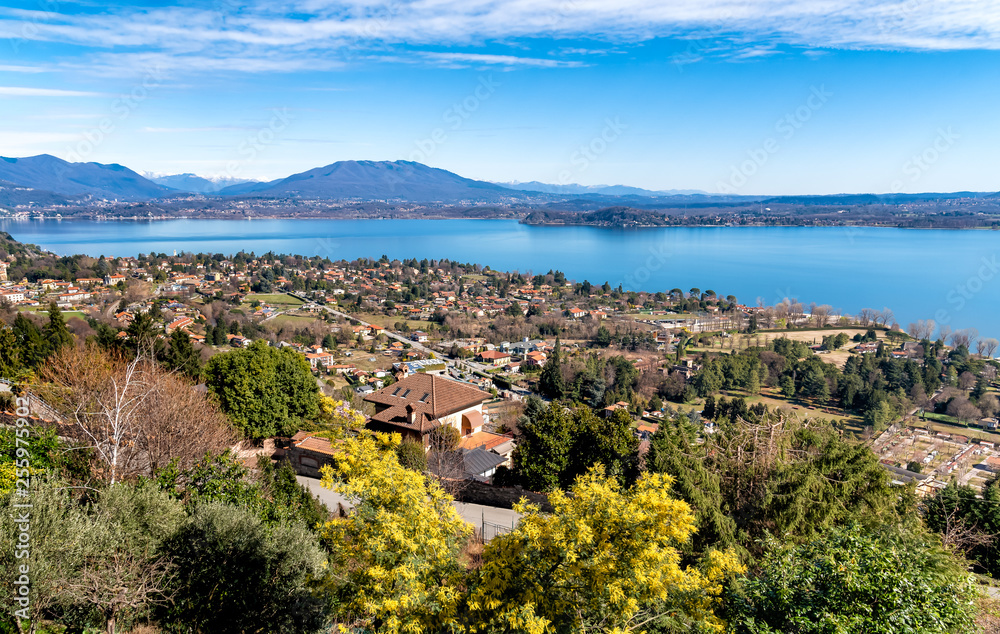 Panoramic view of Lake Maggiore on a clear day, seen from Massino Visconti village over Lesa, Piedmont, Italy