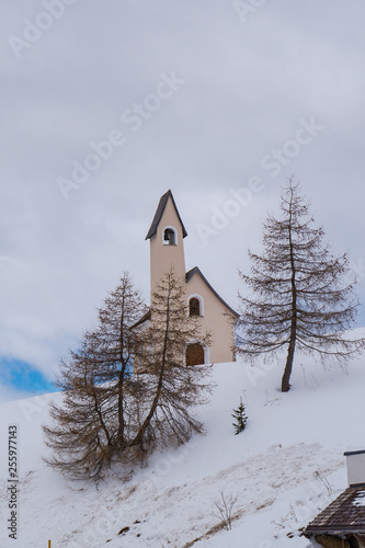 view of the Chapel of saint Maurizio with the snow in the Gardena pass, Val Gardena, Groeden, Bolzano, Trentino Alto Adige, Italy