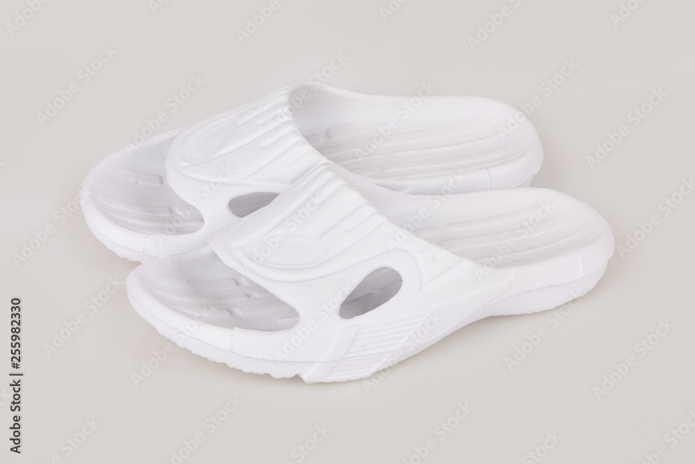 Pair of blank white home slippers. Top and bottom view. Bed shoes accessory footwear. Spa, hotel, wellness - home and hotel slippers isolated Pair of blank white home slippers. Top and bottom view. Bed shoes accessory footwear. Spa, hotel, wellness - home and hotel slippers isolated