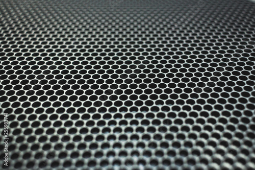 Many details and holes in a black lattice as a background