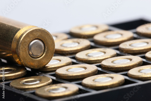 Pile of pistol bullets. The concept of limiting the spread of small arms. photo