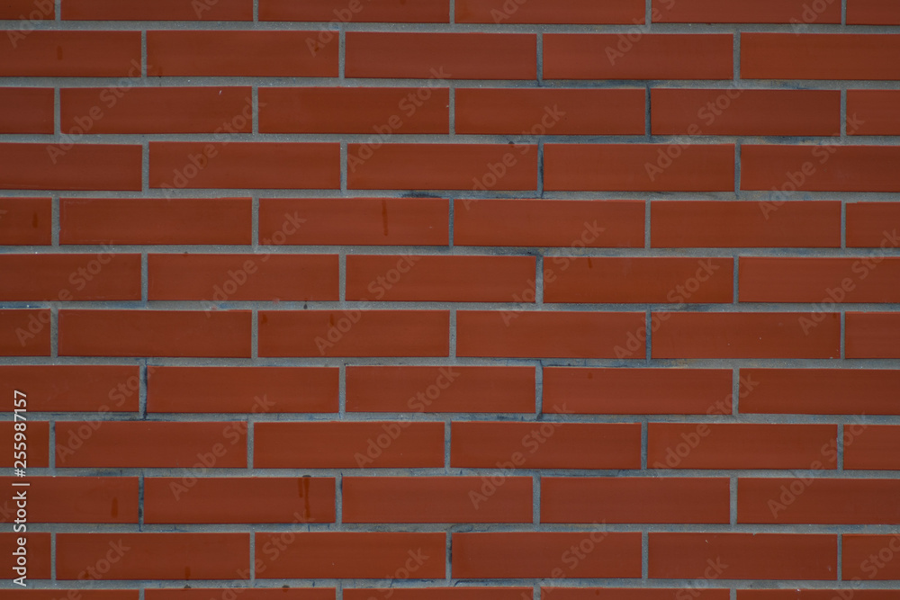 Obraz premium Brick wall with dark and dirty red bricks on it